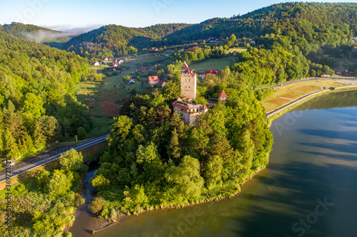 Medieval Tropsztyn castle in Lesser Poland by the Dunajec river. Aerial view in sunrise light.