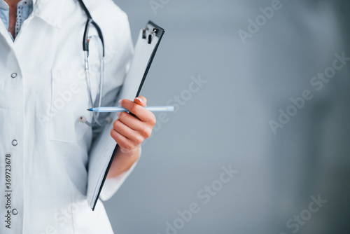 Close up view of young nurse that indoors in modern clinic. Conception of healthcare