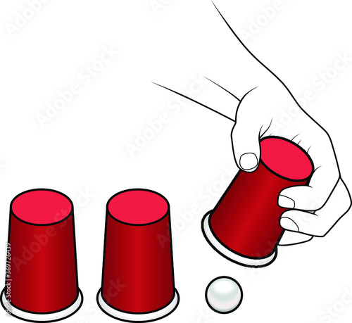 A hand lifting a cup of a cups-and-ball game.