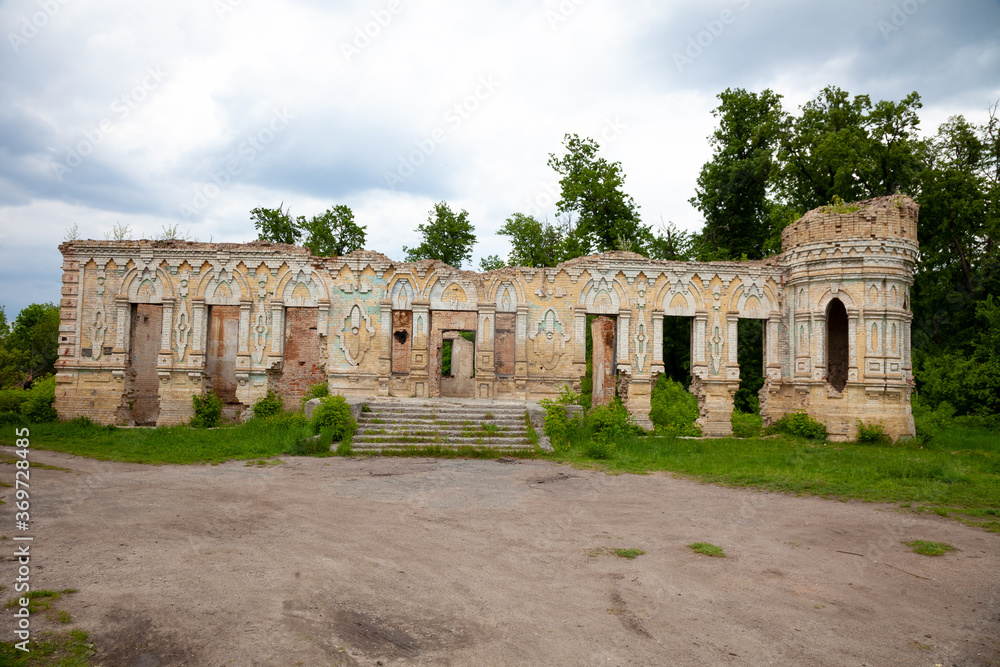 The ruins of the Palace von der Osten Saken on the border of the town of Nemeshaevo and the village of Mirotskoye, Kiev region, Ukraine. Abandoned old manor. The remains of a brick house.