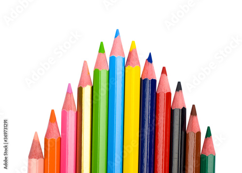 Top arrow shape made with some different colored wood pencil crayons on a white background