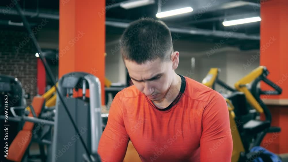 Crossfit workout session of a young man in the gym