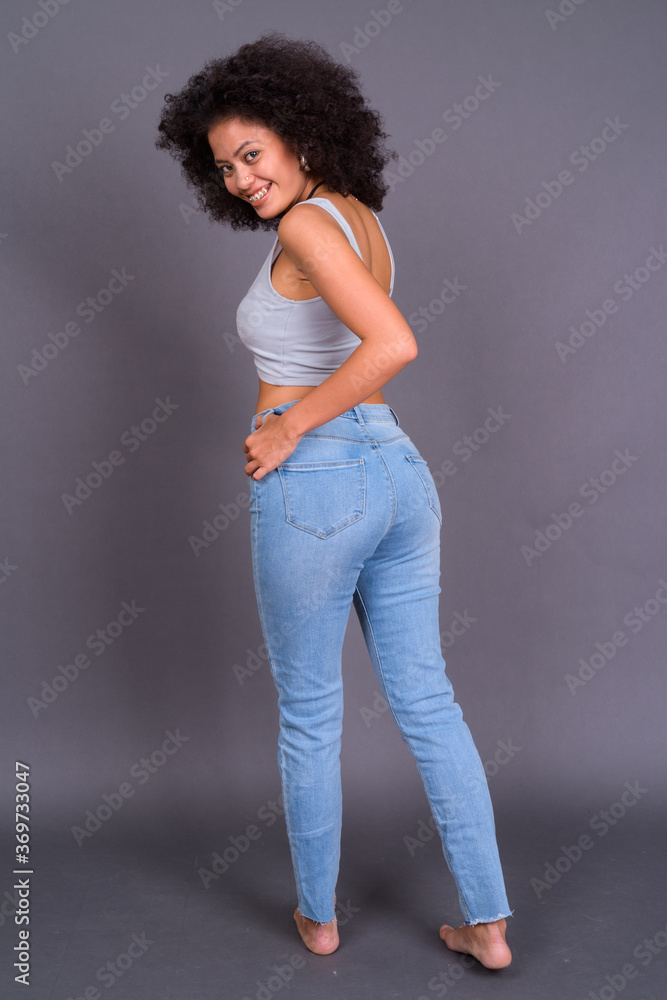Happy young beautiful African woman with Afro hair Happy young beautiful African woman with Afro hair