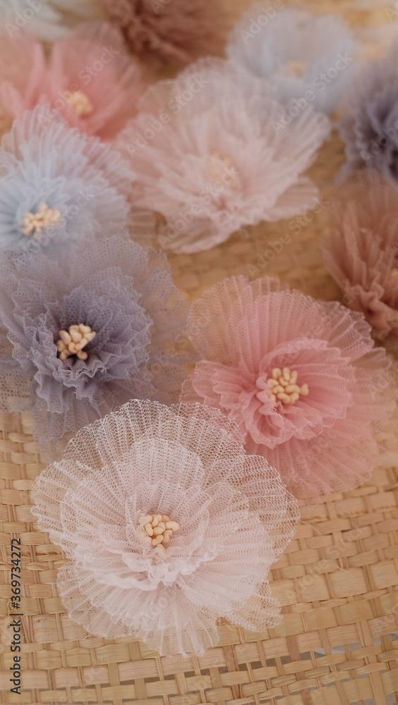 Artificial flower made out of tulle fabric in beautiful pastel colors Artificial flower made out of tulle fabric in beautiful pastel colors