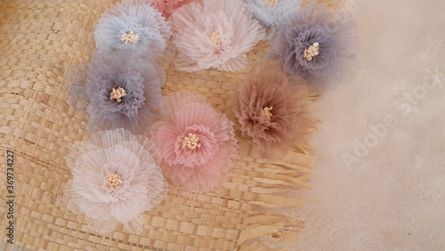 Artificial flower made out of tulle fabric in beautiful pastel colors