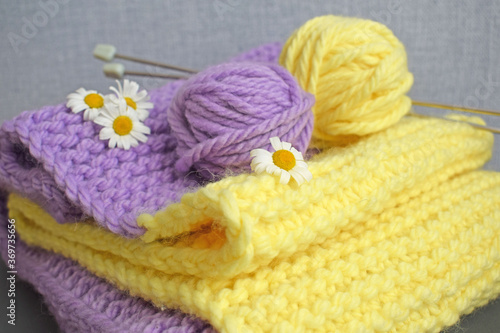A warm lilac-yellow scarf  knitted with thick yarn.Handmade work.