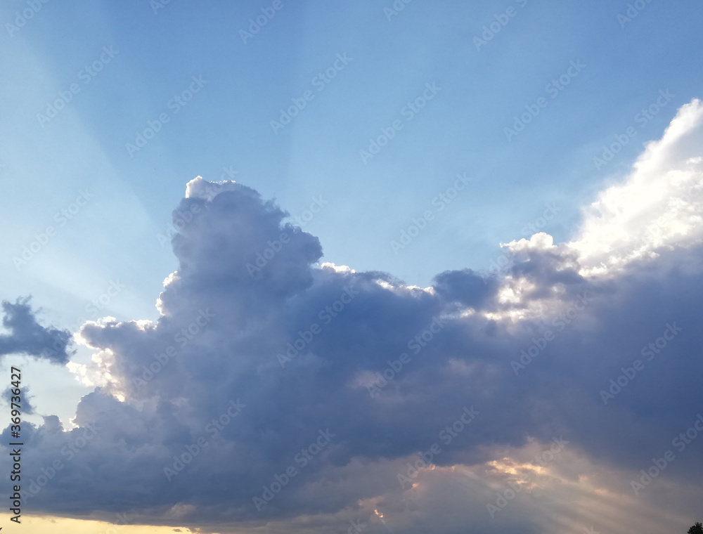 sunset sky with blue shadows and bright sun rays sunset sky with blue shadows and bright sun rays