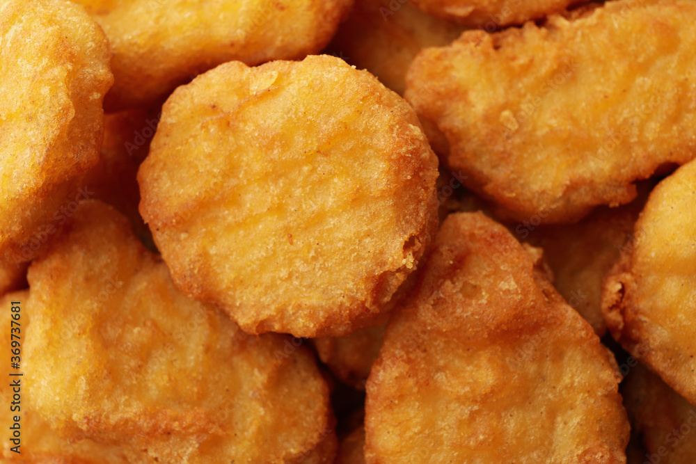 Fried chicken nuggets on whole background, close up Fried chicken nuggets on whole background, close up