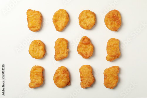 Flat lay with fried chicken nuggets on white background photo