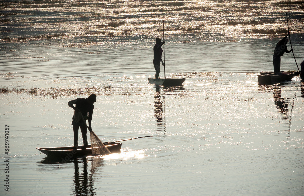 Fishermen catching fish at lake in Dhar city of madhya pradesh state. India.