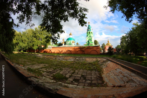 green church with golden domes