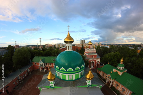 green church with golden domes