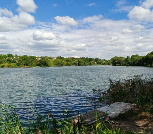 Summer rural landscape  lake and sky