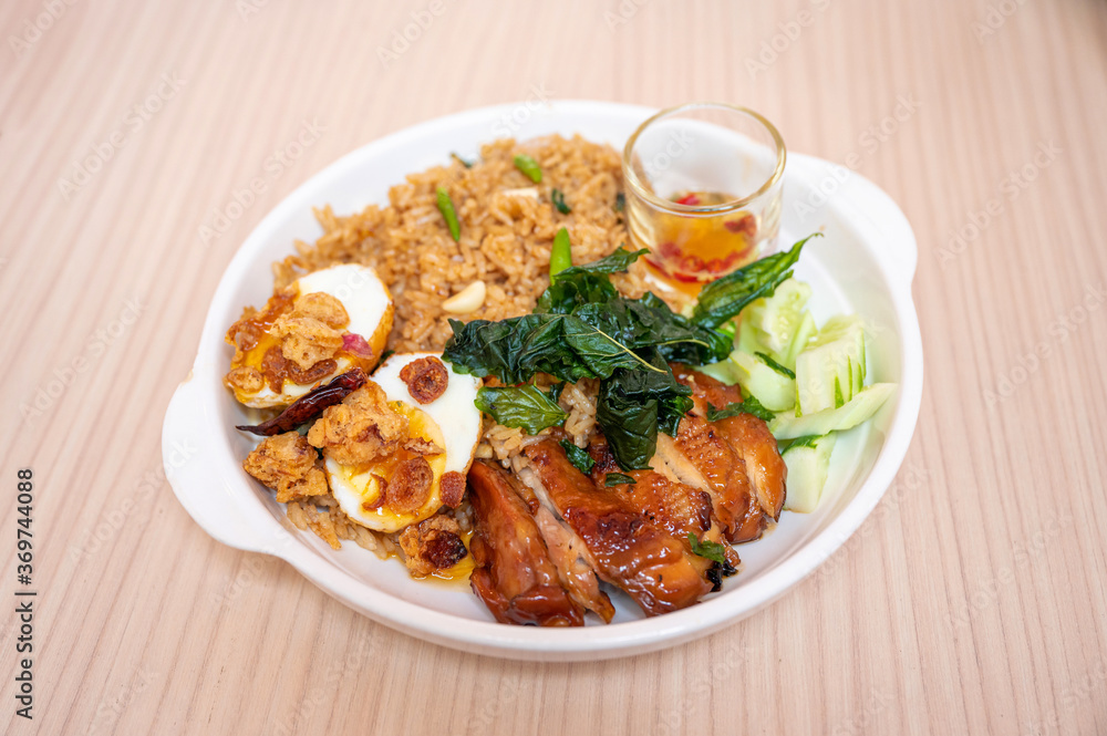 Spicy rice with chicken roasted, egg and vegetable