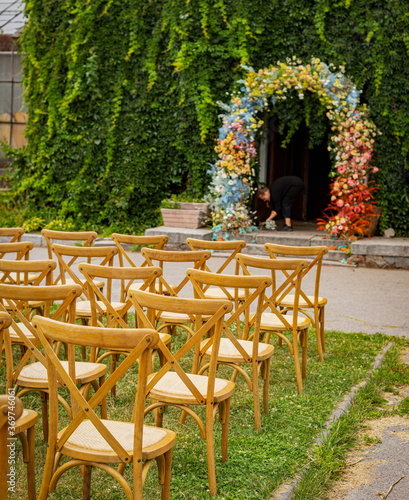 Fototapeta Naklejka Na Ścianę i Meble -  Outdoor wedding ceremony. Wedding arch. Floristic decoration