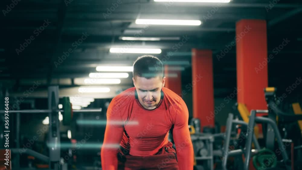 Exercise with a ball is being done by a crossfit athlete Exercise with a ball is being done by a crossfit athlete