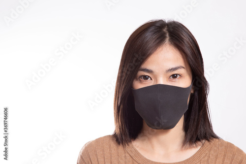 The Asian woman standing on the white background.