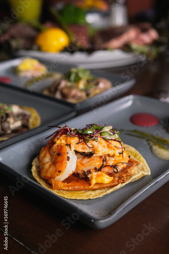 Shrimp and seafood gourmet taco at fine dining restaurant