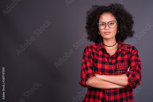 Young beautiful African hipster woman with eyeglasses