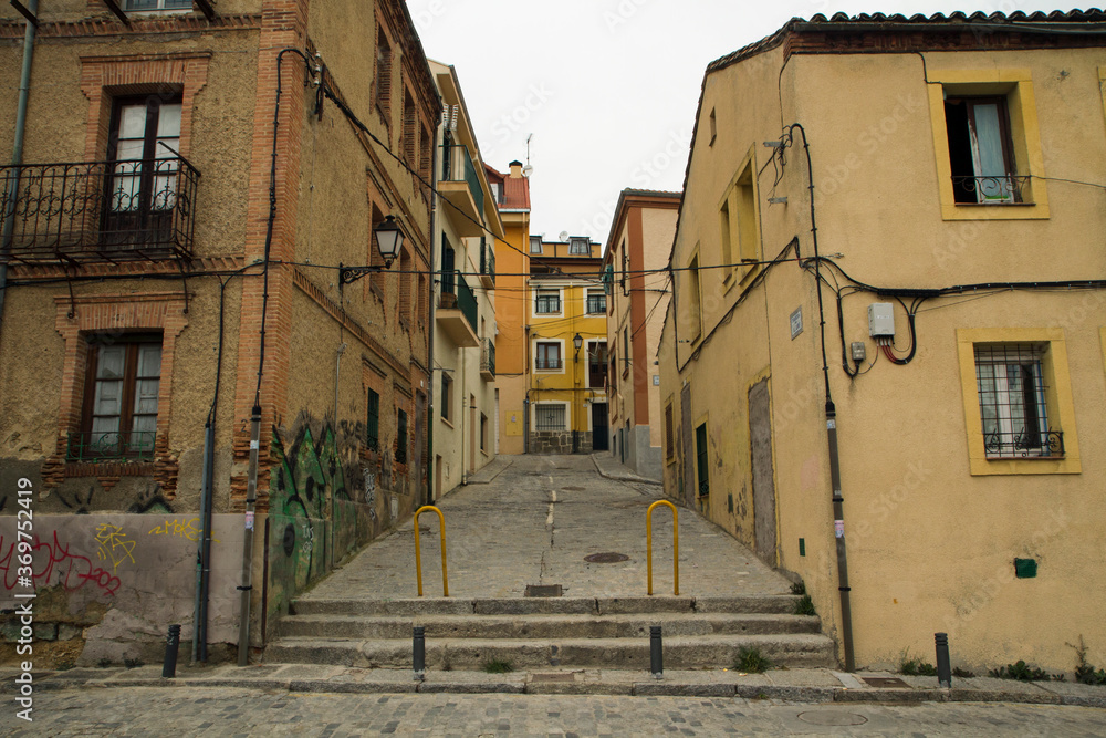 Architecture. Empty alley, paving stone street and sidewalk during coronavirus, Covid-19, pandemic.
