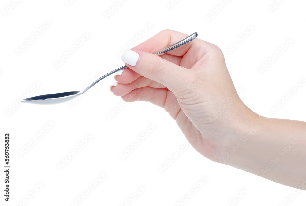 Empty teaspoon in hand on white background isolation Empty teaspoon in hand on white background isolation