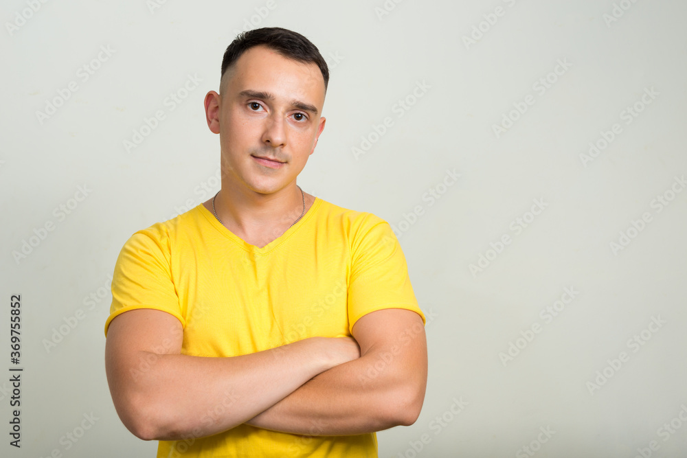 Portrait of handsome man with yellow shirt Portrait of handsome man with yellow shirt