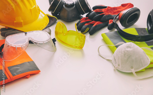 Work safety protection equipment background. Industrial protective gear on white photo