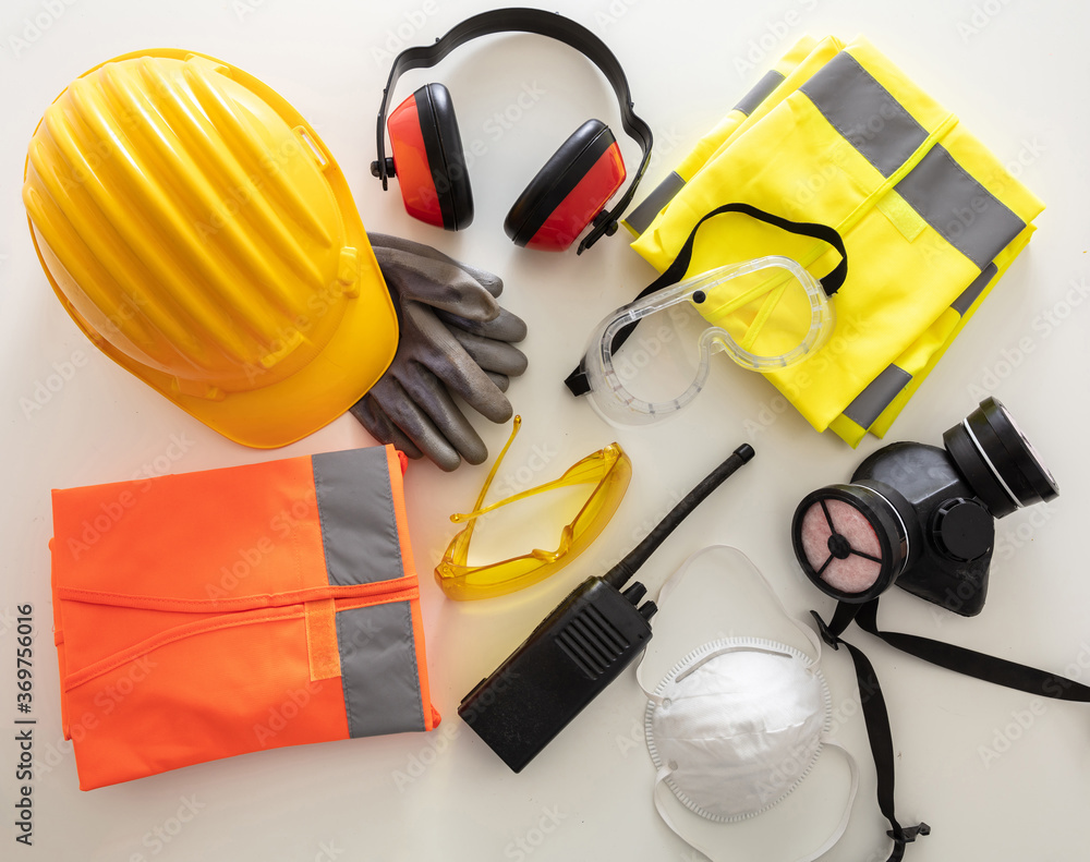Work safety protection equipment background. Industrial protective gear on white - obrazy, fototapety, plakaty 