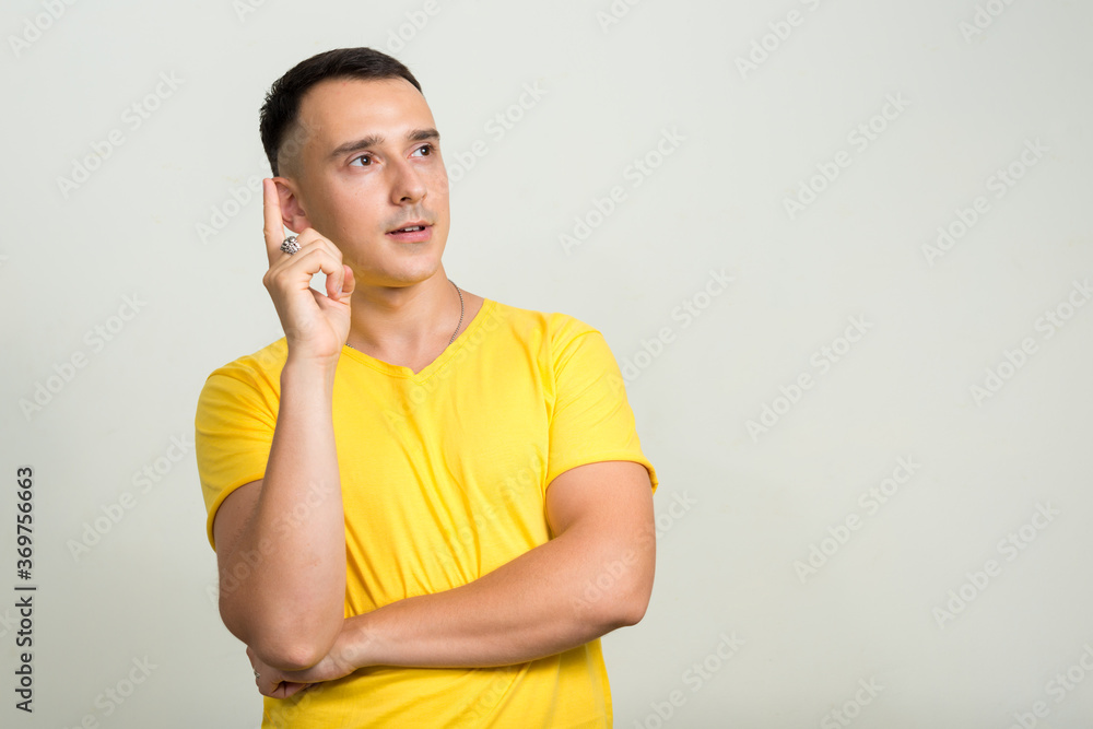 Portrait of handsome man with yellow shirt Portrait of handsome man with yellow shirt