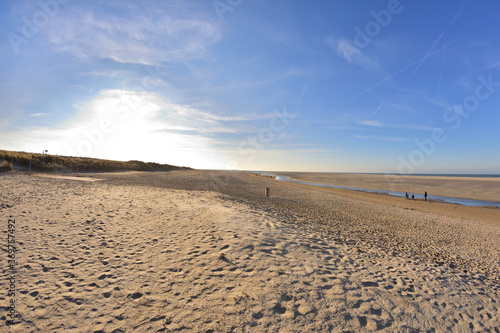 The beach and the sea coast on a sunny day in the fisheye lens. © W Korczewski