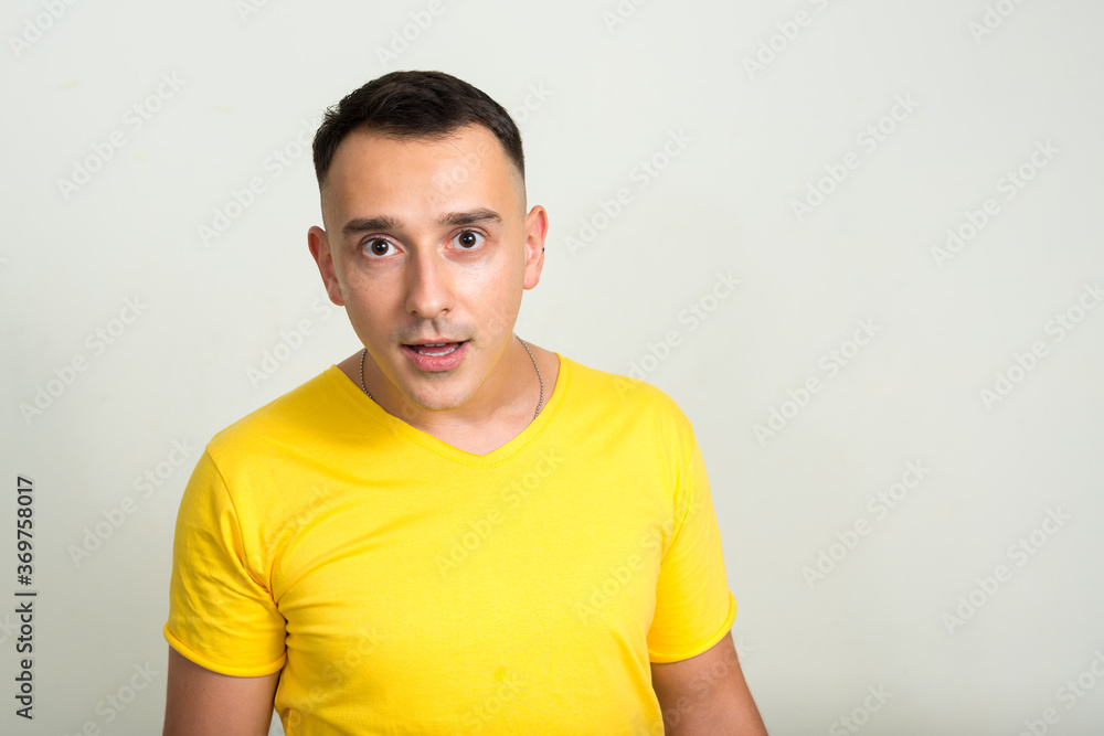 Portrait of handsome man with yellow shirt