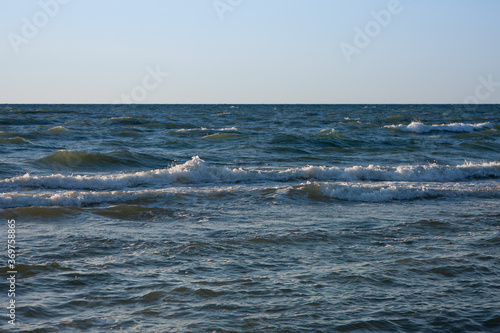 Wallpaper Mural late evening at the Baltic Sea, the sun reflects on the waves Torontodigital.ca