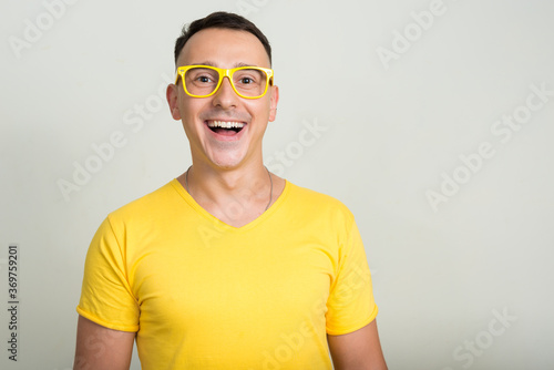 Portrait of handsome man with yellow shirt