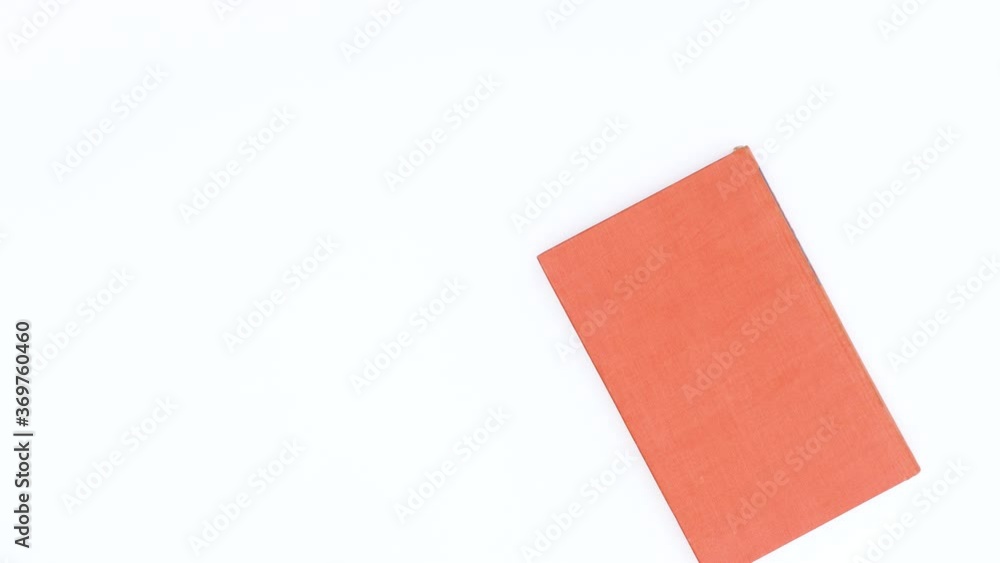 Books different colors passing on white theme. Stop motion Books different colors passing on white theme. Stop motion