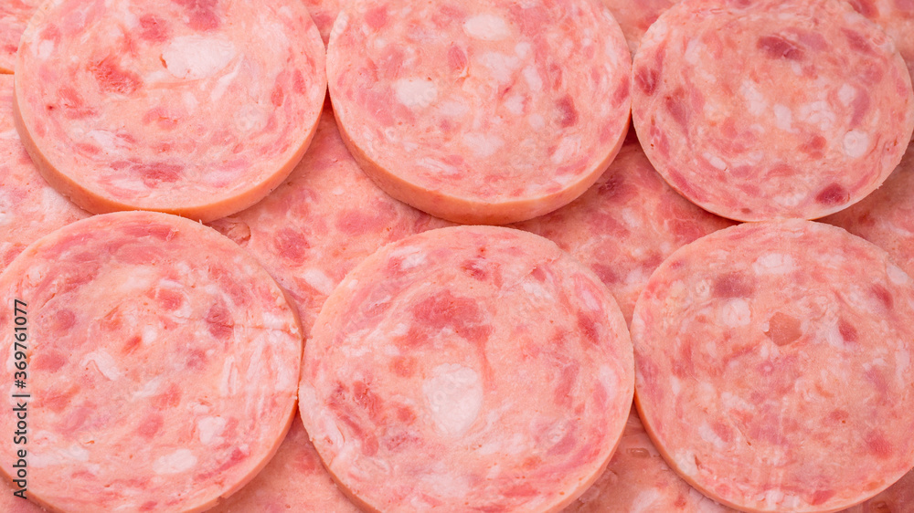 Boiled sausage isolated on white background. Slices. Boiled sausage isolated on white background. Slices.