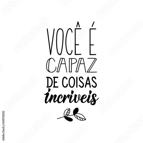 You are capable of amazing things in Portuguese. Lettering. Ink illustration. Modern brush calligraphy. photo