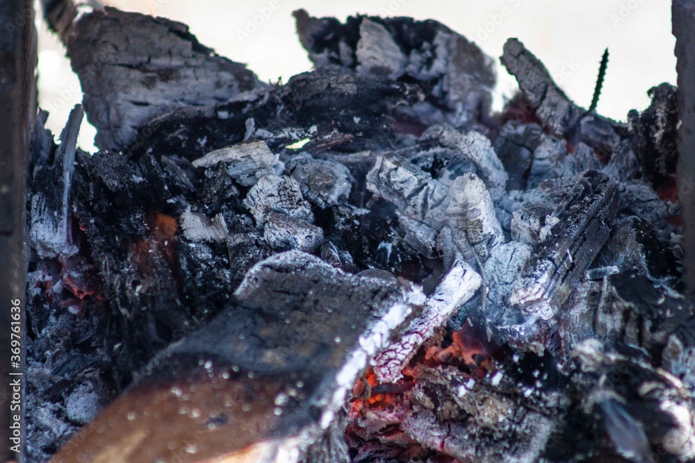 The birch coals burn with a bright flame