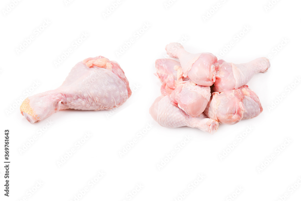 Tasty raw chicken legs. Top view. Isolated on white Tasty raw chicken legs. Top view. Isolated on white