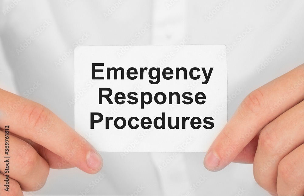 Man's hands take a card with words Emergency Response Procedures, finance and business concept. Man's hands take a card with words Emergency Response Procedures, finance and business concept.