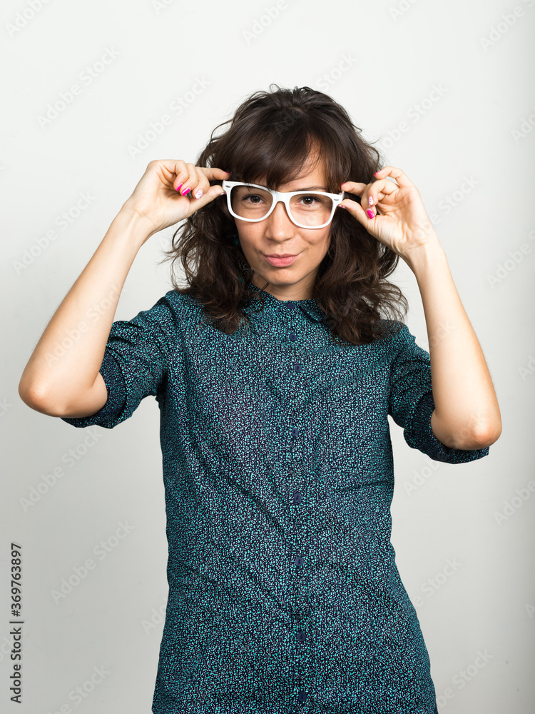 Portrait of beautiful businesswoman with eyeglasses against white background Portrait of beautiful businesswoman with eyeglasses against white background