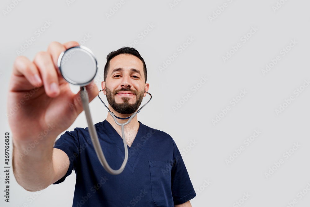 Medical arabian student does auscultation to patient. Doctor uses phonendoscope for auscultation. Medical therapy and treatment. Photo with blanked place for advert Medical arabian student does auscultation to patient. Doctor uses phonendoscope for auscultation. Medical therapy and treatment. Photo with blanked place for advert