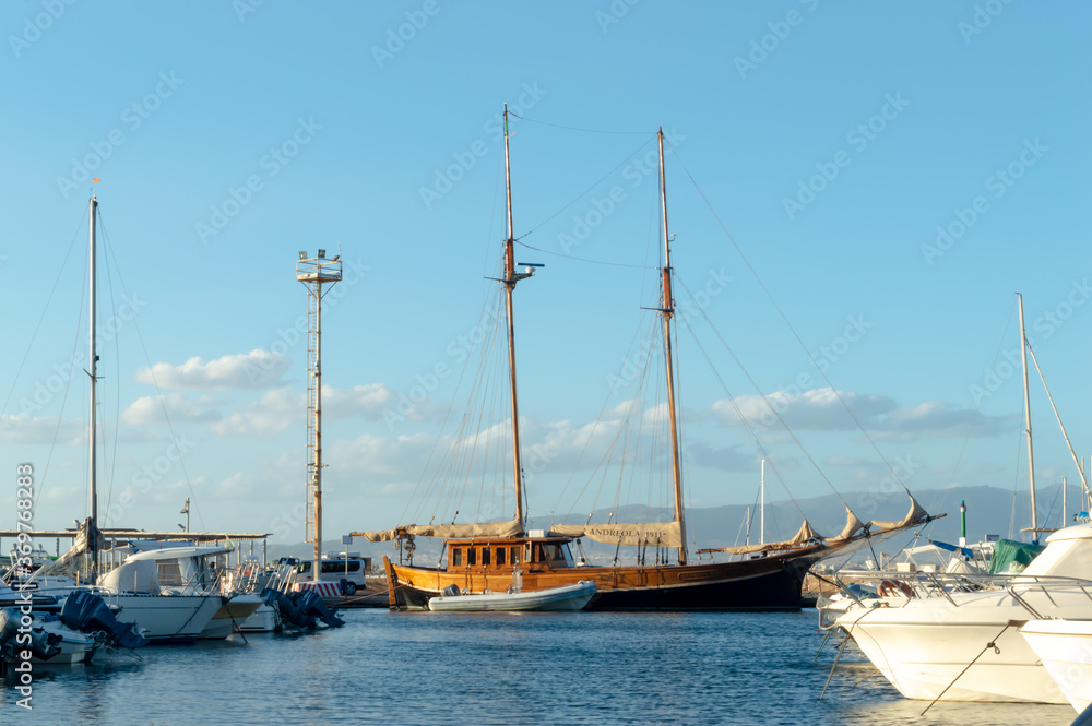 wooden boat moored in a dock in mediterranean sea