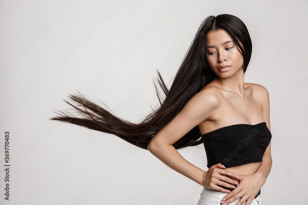 Fototapeta premium Beauty portrait of young asian woman with long dark hair