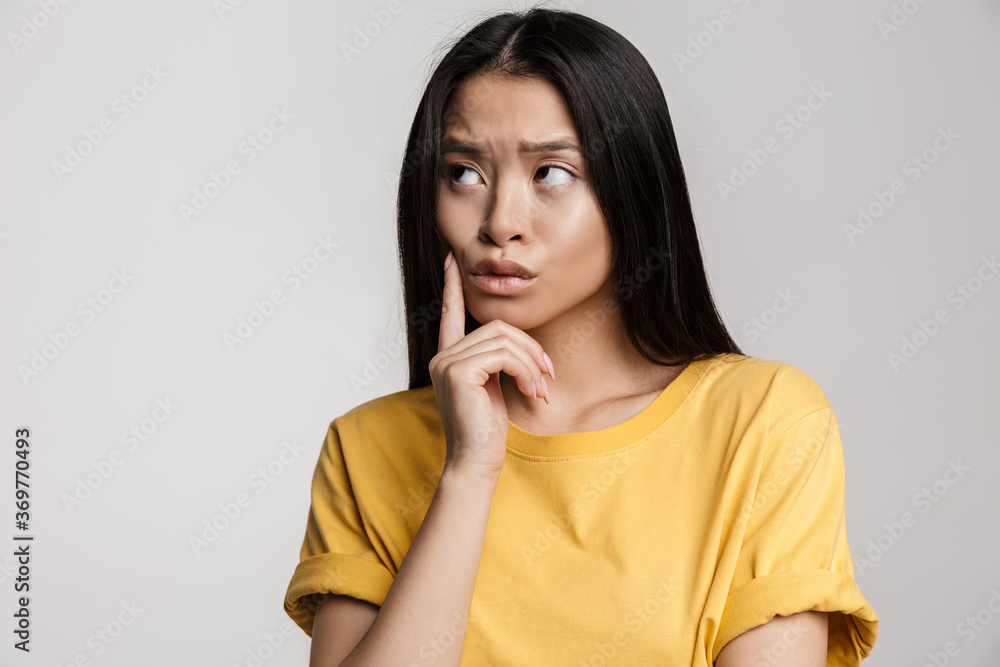 Youbg thoughtful woman wearing casual clothes Youbg thoughtful woman wearing casual clothes