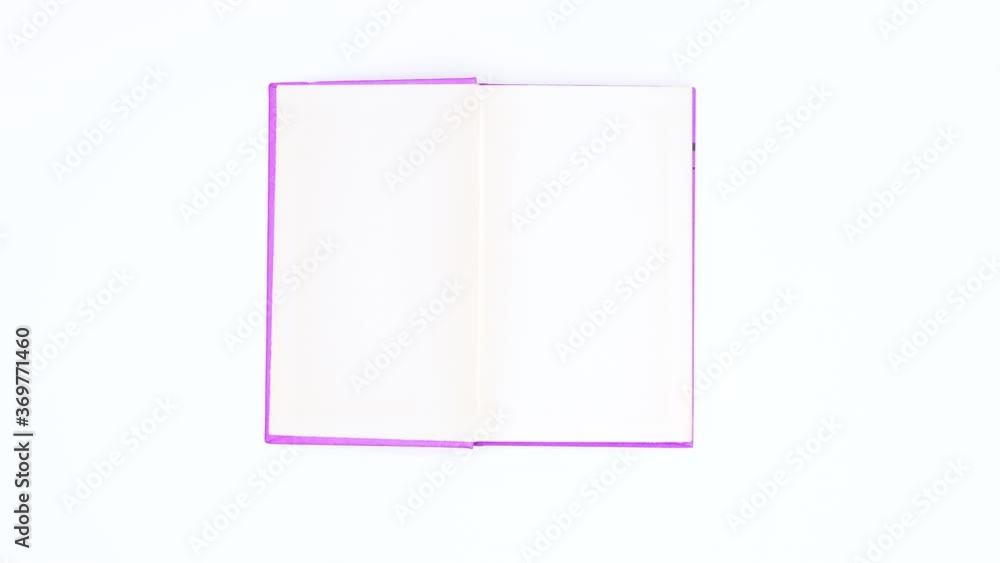 Light purple book appear and open. Stop motion Light purple book appear and open. Stop motion