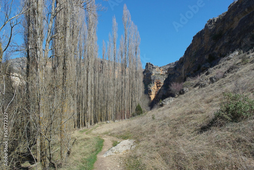 Nice path that runs through a canyon on a beautiful sunny winter day with a spectacular deep blue sky. Sickles of the Duratón river, Segovia, Spain
