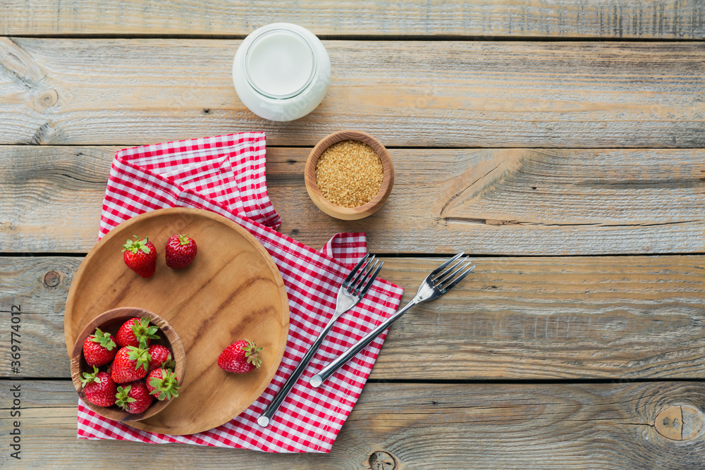 Heap of fresh strawberries in wooden bowl on rustic background. Healthy eating and diet food concept. Heap of fresh strawberries in wooden bowl on rustic background. Healthy eating and diet food concept.