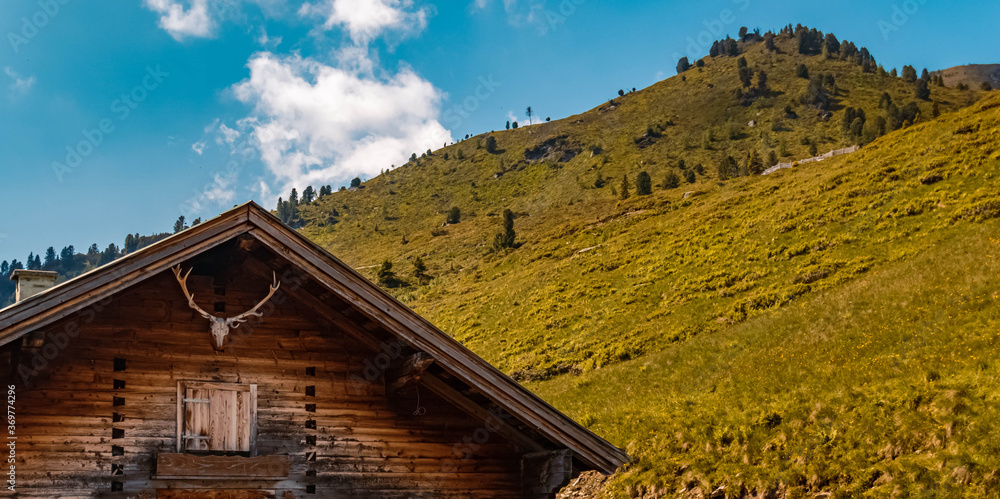 Beautiful alpine view with a wooden house at the famous Zillertaler Hoehenstrasse, Ried, Zillertal, Tyrol, Austria Beautiful alpine view with a wooden house at the famous Zillertaler Hoehenstrasse, Ried, Zillertal, Tyrol, Austria