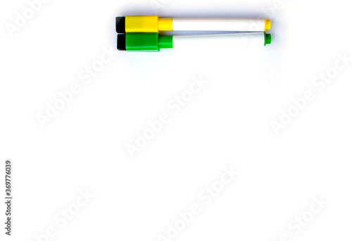 Green and yellow marker isolated items on white background