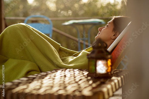 happy woman relaxing at home in front of nature photo